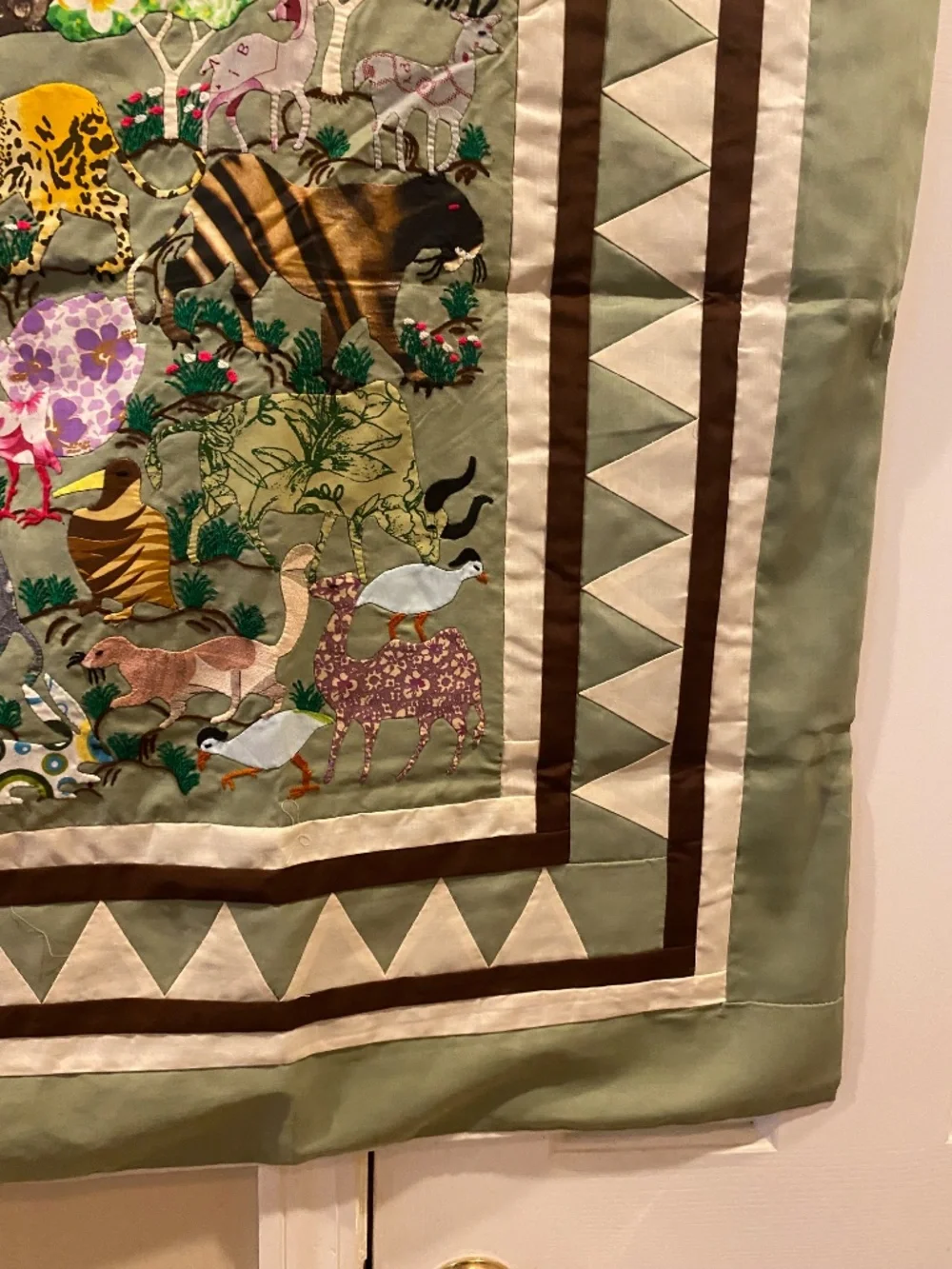 Quilt-style wall hanging with animal designs for decorating a child's room (New)